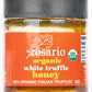 A jar of daRosario Organic White Truffle Honey with a label showing the brand name and the product name, indicating it contains 100% organic Italian truffles, with a weight of 3oz.