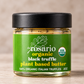 A 2 oz glass jar of daRosario organic black truffle plant-based butter with a green label and black lid on a neutral beige background