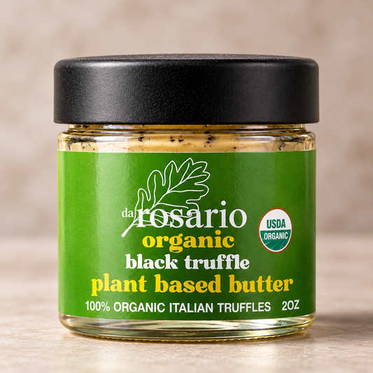 A 2 oz glass jar of daRosario organic black truffle plant-based butter with a green label and black lid on a neutral beige background