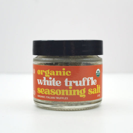 Jar of organic white truffle seasoning salt on a white background